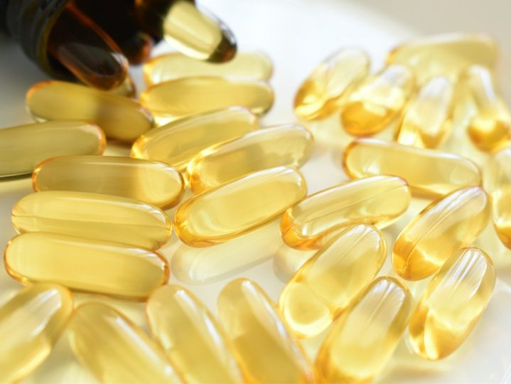 Fish oil supplement capsules on the table.