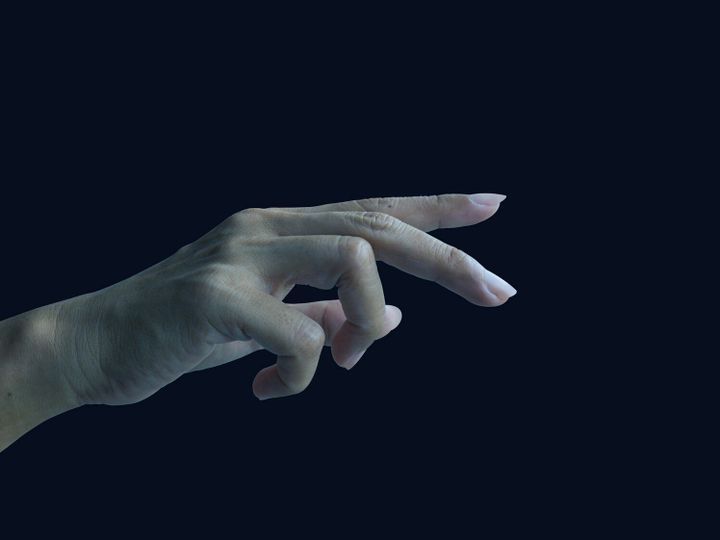 Holding finger hand on black background