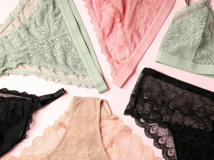 Beautiful set of women's underwear on pink background