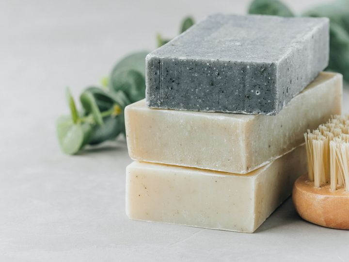 Soap. Organic soap bars. Stack of natural soap bars on gray stone background