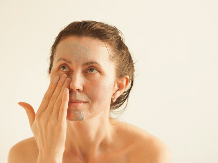 A woman does a facial peeling