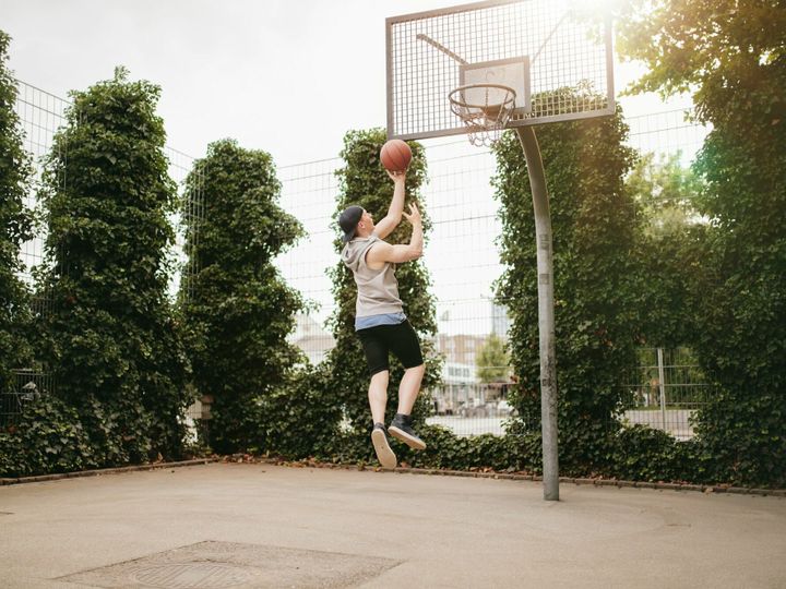 Teenage guy playing streetball