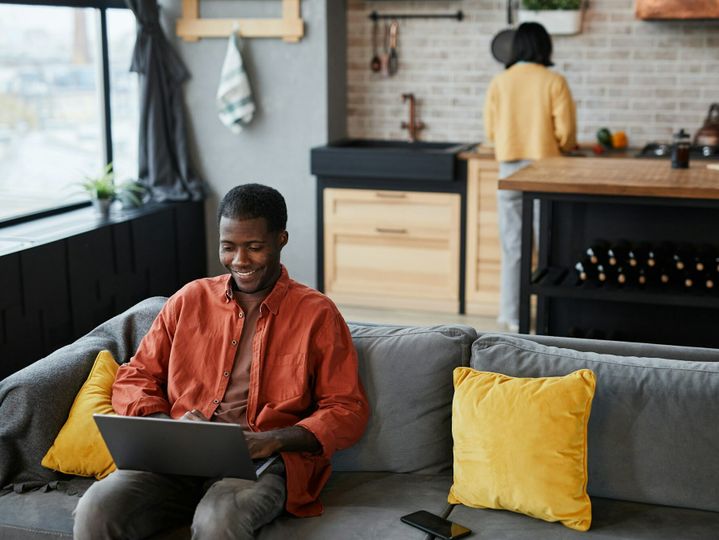 Man using Laptop on Couch