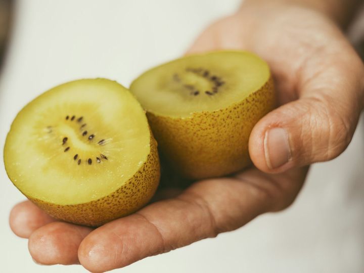 Close up of sun kiwi vitamin fruit cutted in two parts. Concept of food and vitamin for healthy