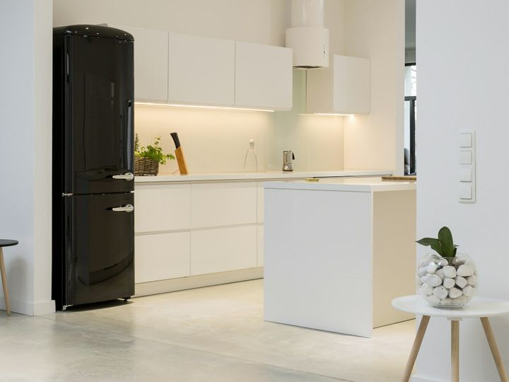 White kitchen with black fridge