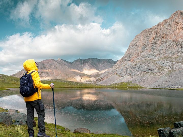 An explorer with yellow outdoor jacket