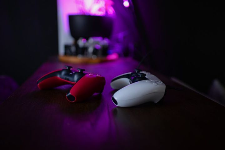 Retro neon game controller. Gamepad for games. Sci-fi Cyber futuristic purple-pink colors joystick