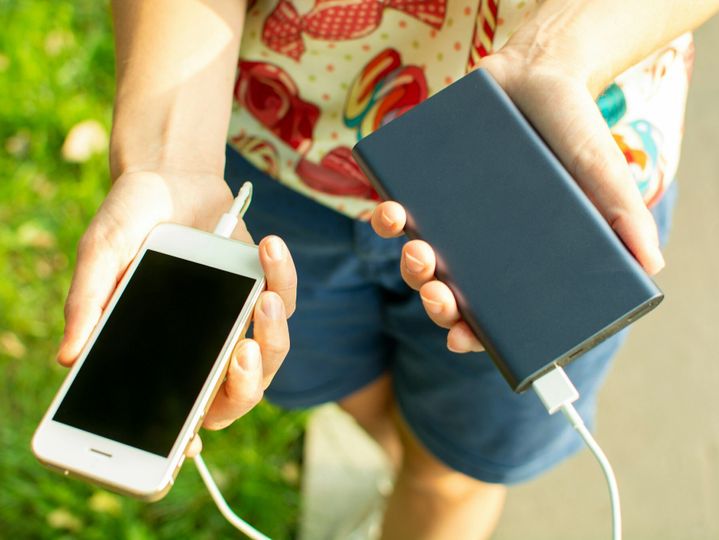 girl with phone and power bank