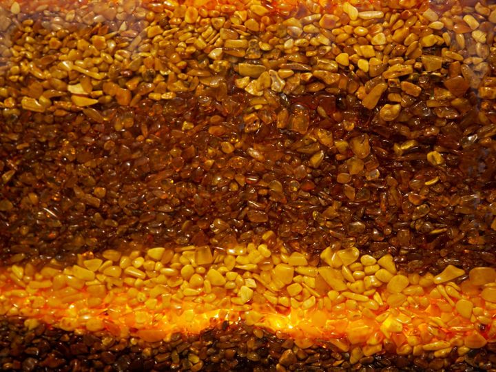 Amber background. Natural gemstone amber for making jewelry.