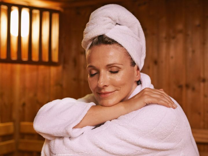Feeling serene in the sauna. Shot of a mature woman in a sauna.