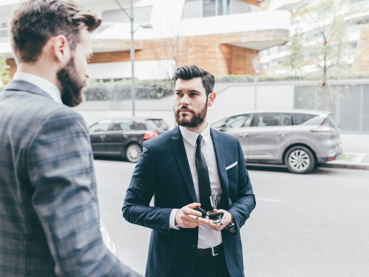 Two businessmen walking outdoor