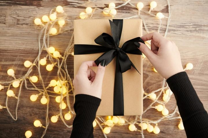Woman Opening Christmas Present