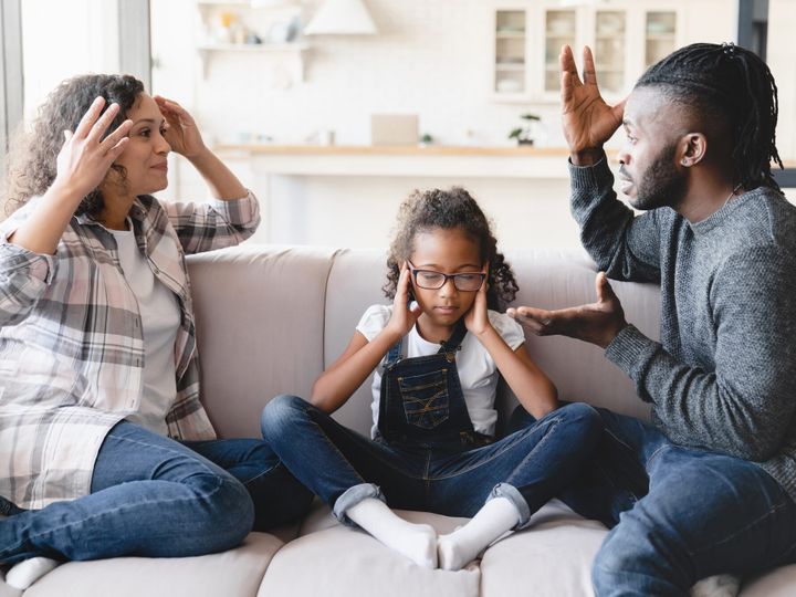 Sad girl and her parents divorce, arguing having marriage problems. Misunderstaning between partners