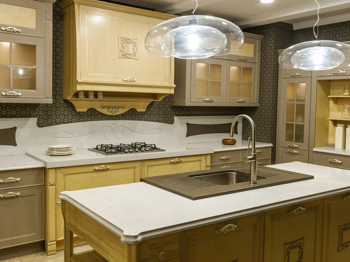 Renovated kitchen interior with lamps over counter