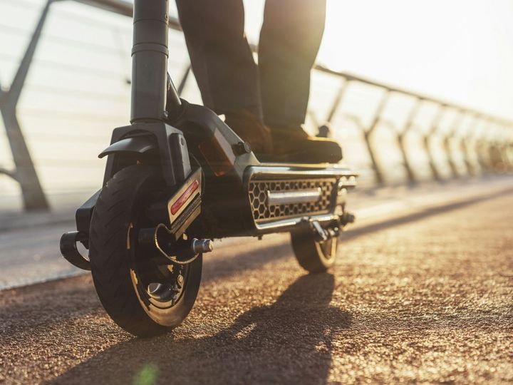 Walk on an electric scooter