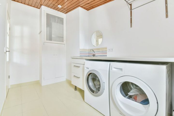 Large laundry room with washer and dryer