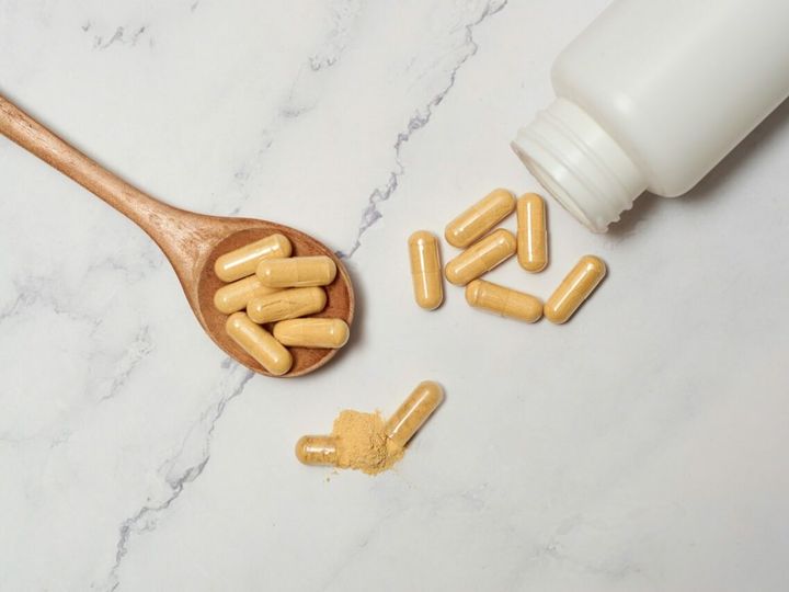 Pills of nutritional supplements and probiotics for better digestion.