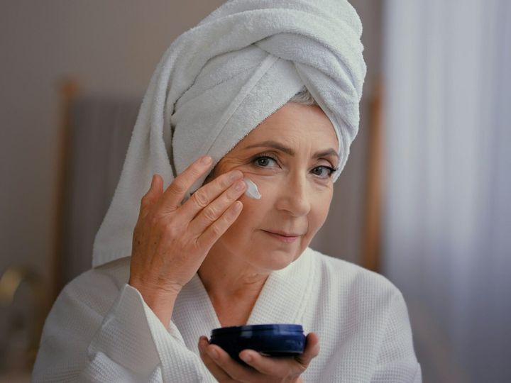 Portrait beautiful Caucasian old 60s woman 50s lady grandmother aged model with towel on head face