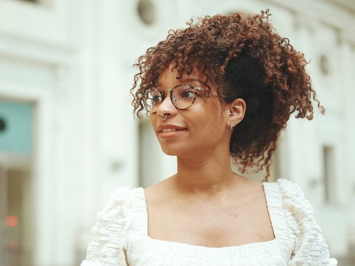 Young woman with glasses standing at the station