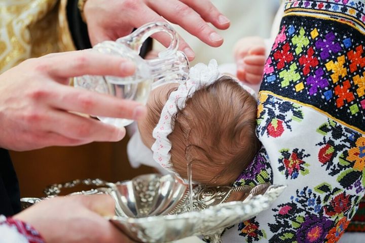 Ceremony of Christening newborn in Christian Church