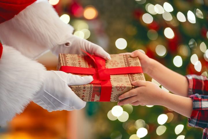 Santa Claus giving gift to child