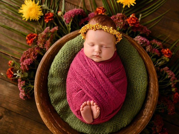 Close-up beautiful sleeping baby girl. Newborn baby girl, asleep on a blanket