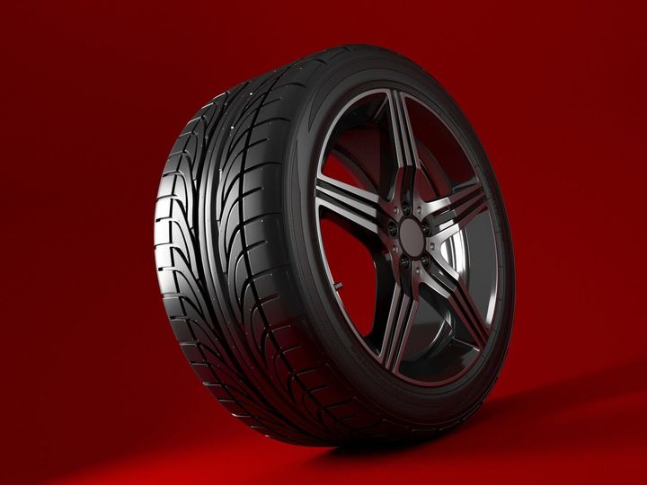 Car wheel isolated on a red background. Tyre. Poster design. 3d illustration