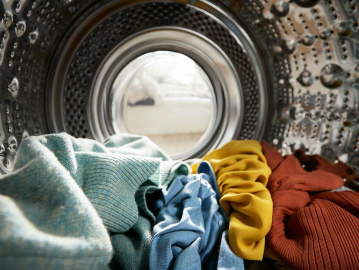 View Looking Out From Inside Washing Machine Filled With Laundry