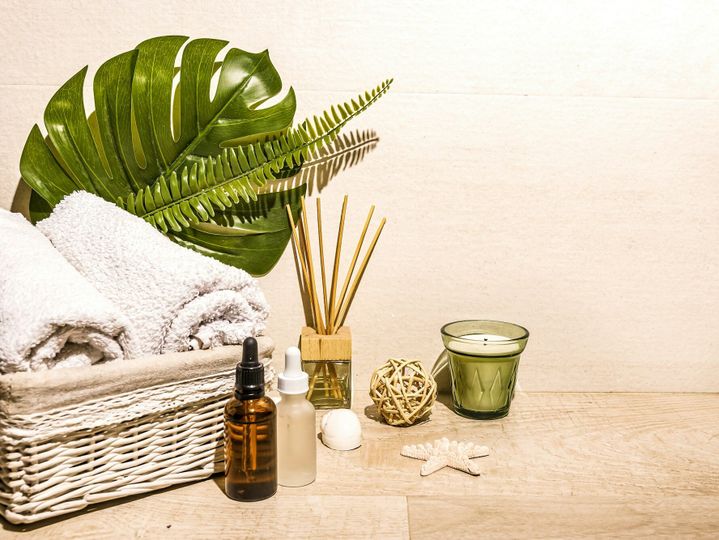 Spa day, composition with towels, oils bottles, candles, aromatherapy massage, relax, warm light