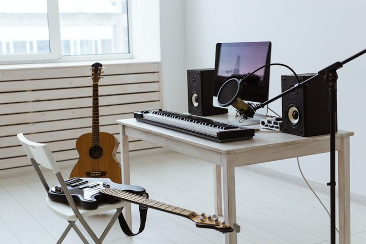 Microphone, computer and musical equipment guitars and piano background