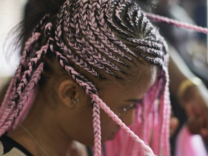 Young woman with pink braids, close-up