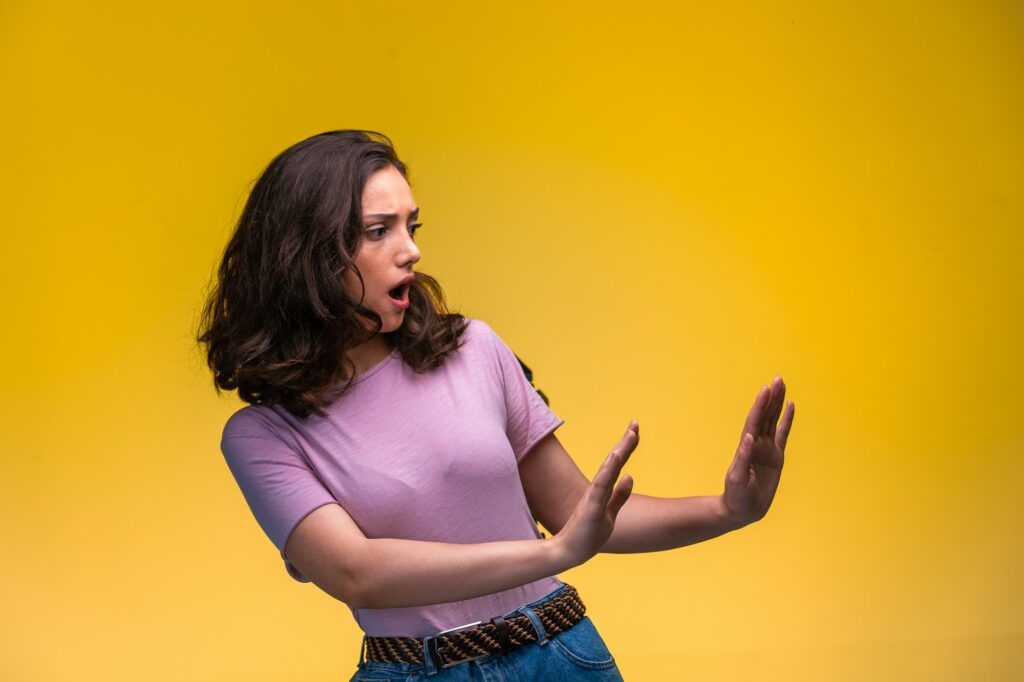 Young girl trying to prevent danger from right