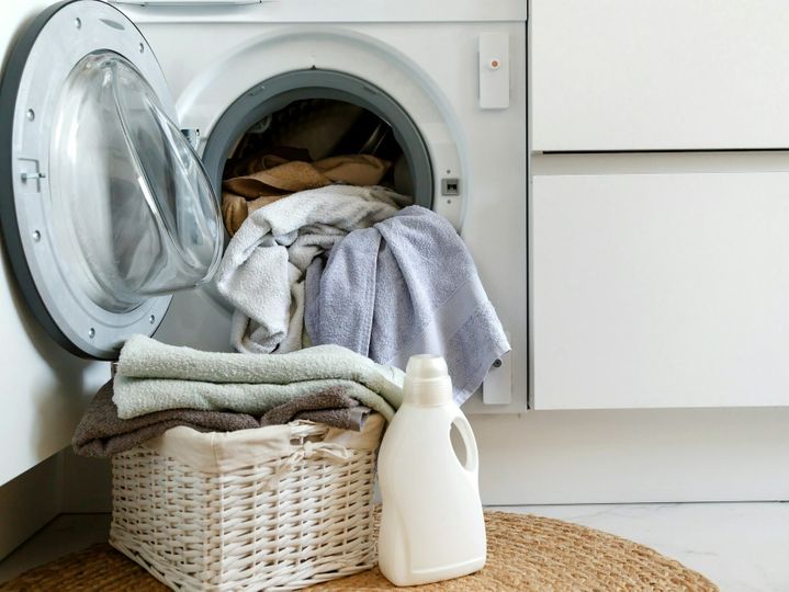 Loading a washing machine and washing clothes