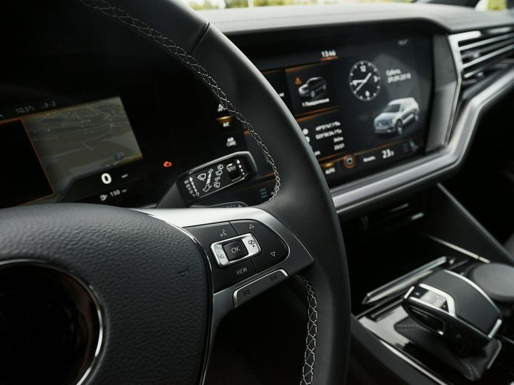 Interior of a prestigious modern black car. Leather comfortable seats and accessories and steering