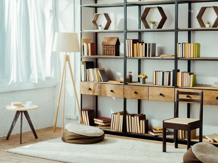 interior of living room with wooden furniture and books