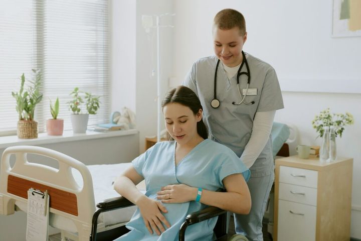 Nurse Comforting Woman in Labor