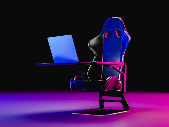 Gaming chair with modern laptop. 3d render