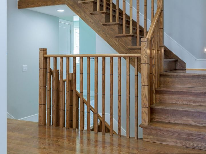 Interior of stylish house: corridor, entry, staircase wooden stairs in the house