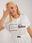 Sukienka ecru plus size z wiązaniem w pasie - zdjęcie 5