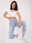 Jasnoniebieskie spodnie jeansowe skinny z aplikacjami - zdjęcie 3