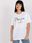 Biały damski t-shirt z napisem i aplikacją - zdjęcie 6