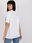 Biały damski t-shirt z napisem i aplikacją - zdjęcie 5