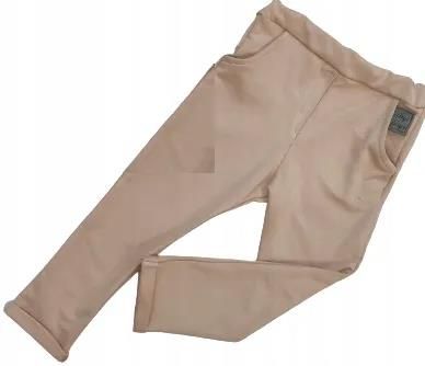 Spodnie beżowe z kieszonkami rozmiar 116