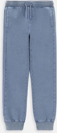 Spodnie dresowe  niebieskie z kieszeniami o fasonie SLIM