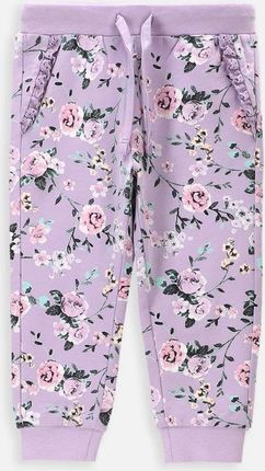 Spodnie dresowe fioletowe z nadrukiem w kwiaty na całości