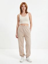 Zdjęcie Damskie spodnie dresowe oversize UNLEASH WINGS BEIGE - Jarocin