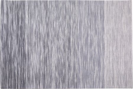 Beliani Ręcznie tkany dywan wełniany do salonu niskie włosie szary 140 x 200 cm Kapakli