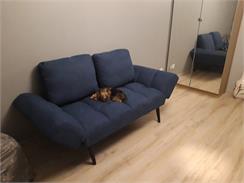 Beliani Sofa pikowana rozkładana opuszczane podłokietniki funkcja spania niebieska Brekke
